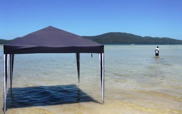 Beach with shade canopy at Tiona Holiday Park in the North Coast of NSW