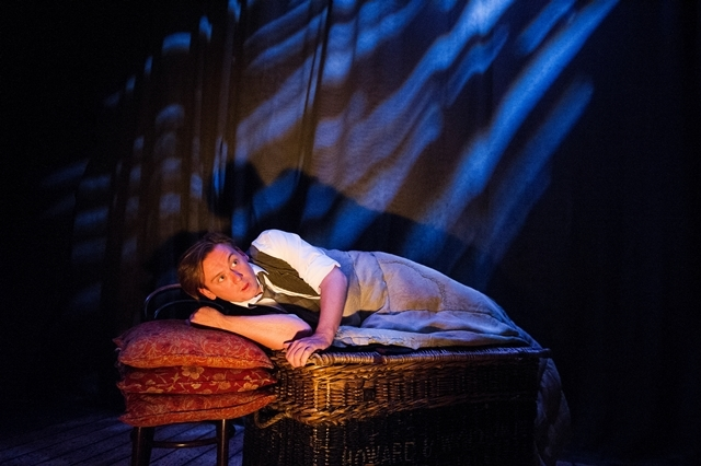 Man awaking from sleep during the stage production of The Woman in Black in London.