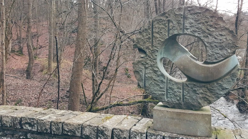 "A Time for Healing" stone monument on a bridge in Hurtgen Forest