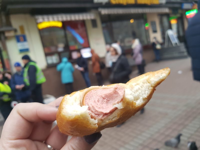 The inside of the hot dog with line of people waiting to purchase one