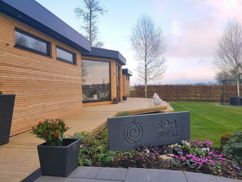 Exterior of Spa Shell with wooden panelling at Fishmore Hall 