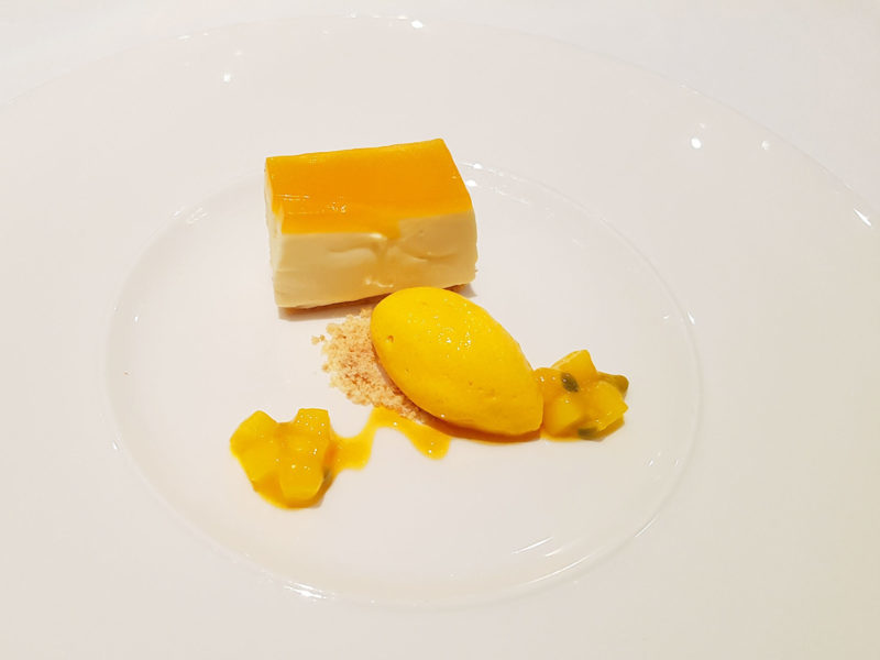 White chocolate cheesecake with passionfruit and mango sorbet