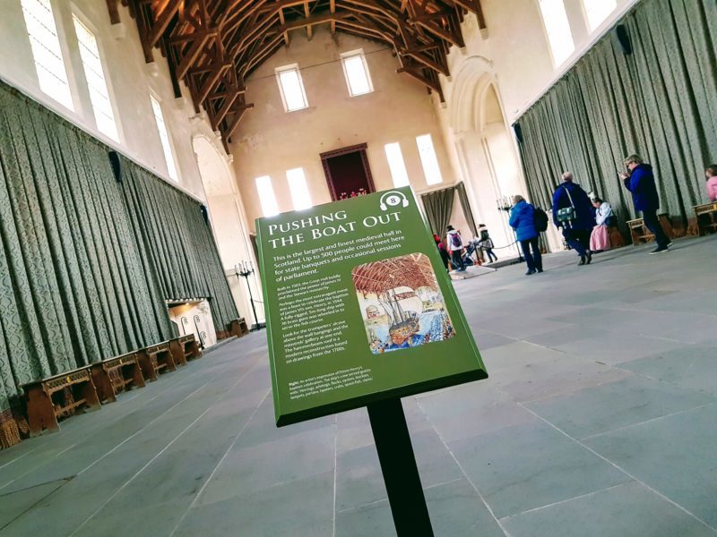 Photo of sign and the great hall in stirling castle