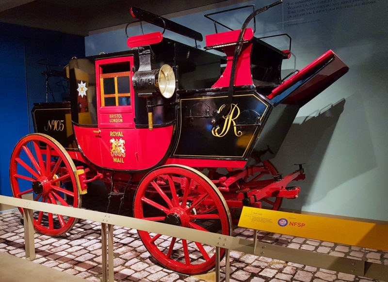A Mail Coach on display at The Postal Museum