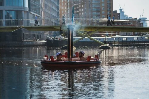 People enjoying the hot tub boat in Canary Wharf