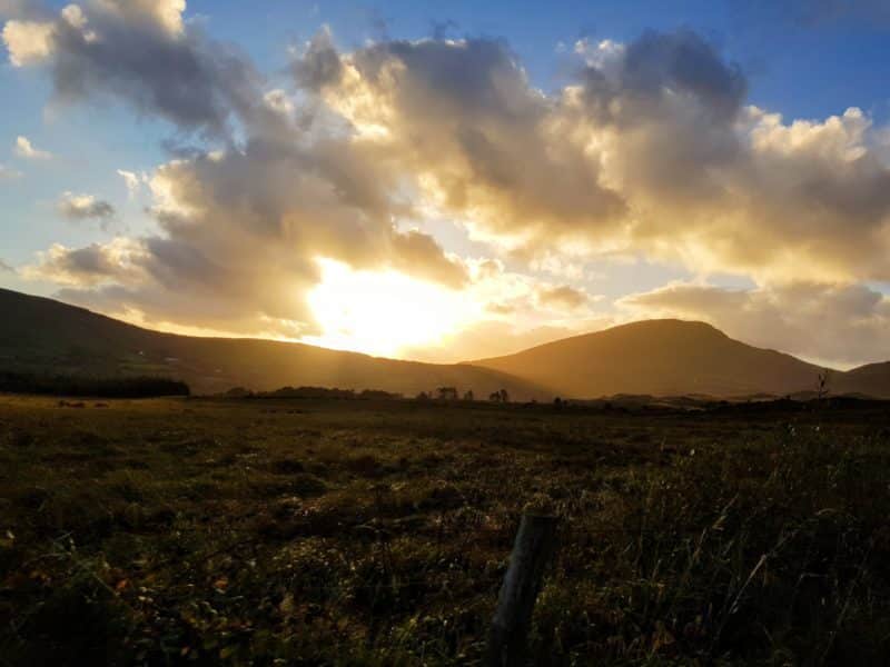 Sun setting behind Ring of Kerry mountains