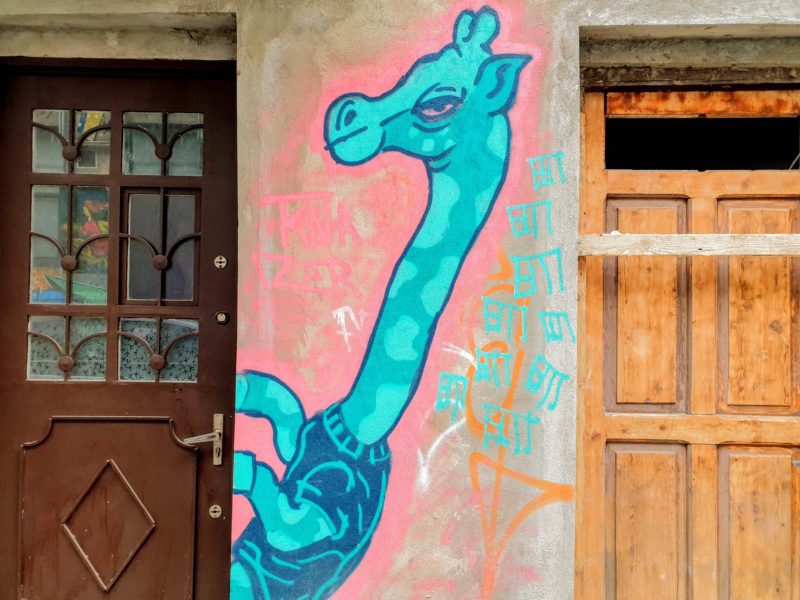 Street art of blue giraffe