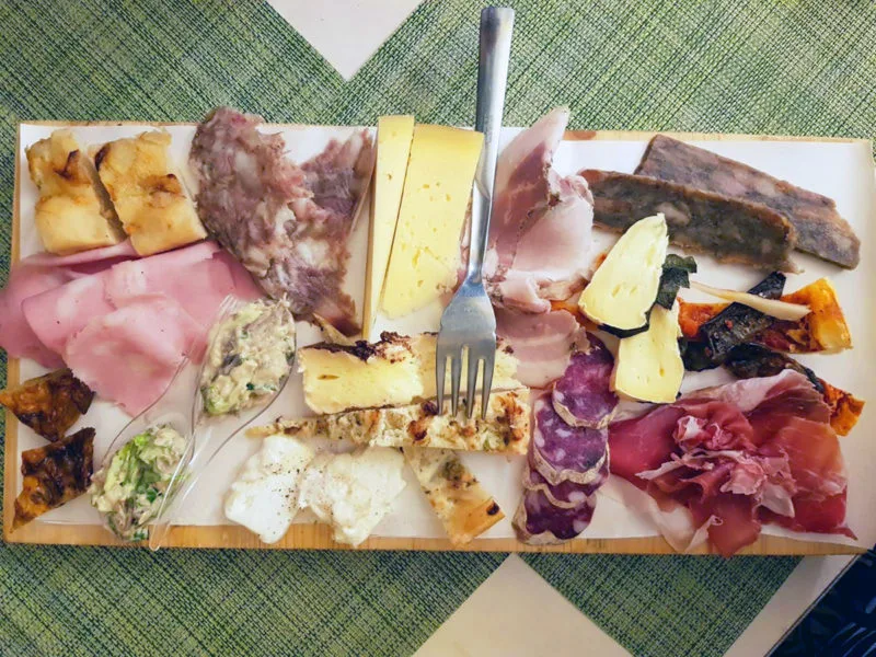 Cheese and charcuterie board in Bologna. There's so much on offer to eat in Bologna, Italy. Make the most of it and enjoy it all.