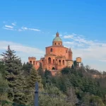 The terracotta-coloured exterior of the San Luca Bologna Monastery