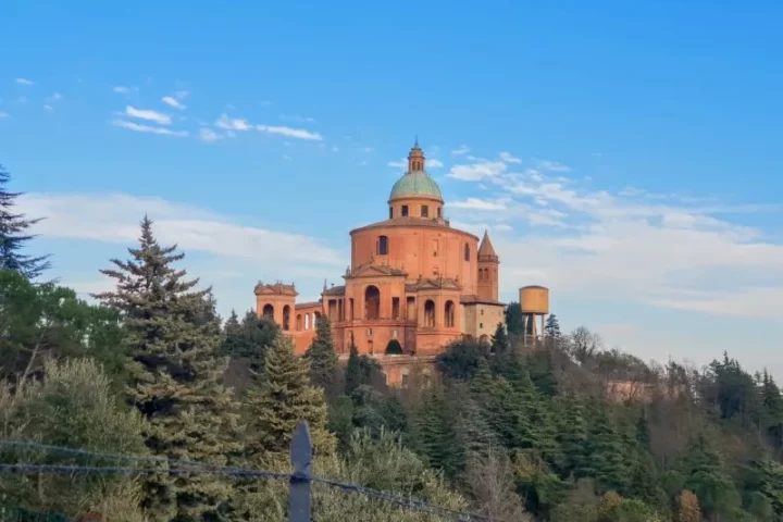 The terracotta-coloured exterior of the San Luca Bologna Monastery