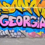 Georgia written in pink paint in one of the pieces of street art seen in Tbilisi Georgia