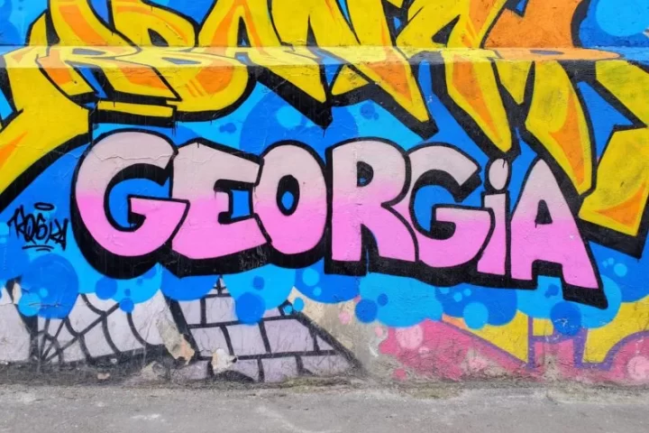 Georgia written in pink paint in one of the pieces of street art seen in Tbilisi Georgia