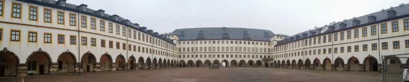 wide angle photo of Friedenstein Castle showing the many arches in the courtyard.