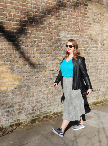 Grey midi skirt in central London. The Midi Skirt is perfect for travel and it's also flexible and versatile for many other occasions as well.