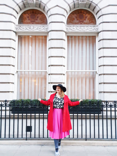 Pink midi skirt in central London. The Midi Skirt is perfect for travel and it's also flexible and versatile for many other occasions as well.