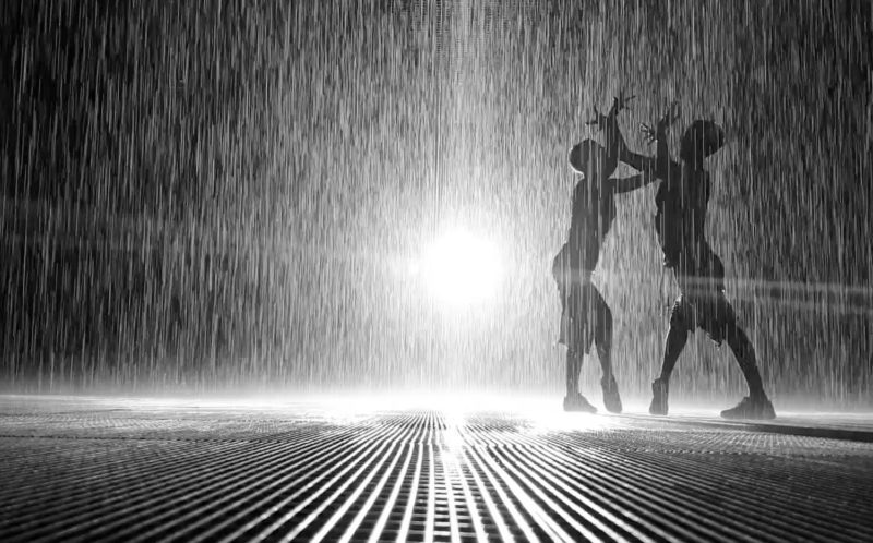 People silhouettes in the Rain Room in Sharjah 