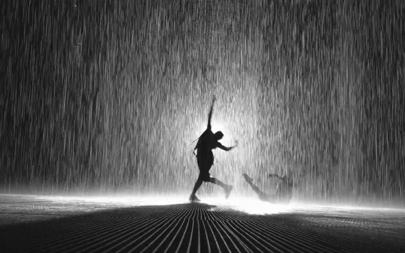 People silhouettes in the Rain Room in Sharjah 