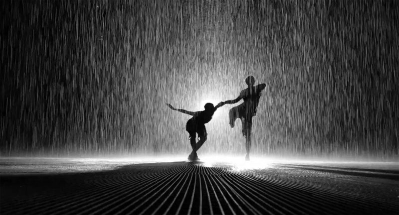 People silhouettes in the Rain Room in Sharjah 