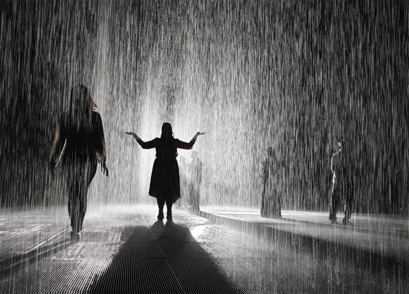 People silhouettes in the Rain Room in Sharjah 