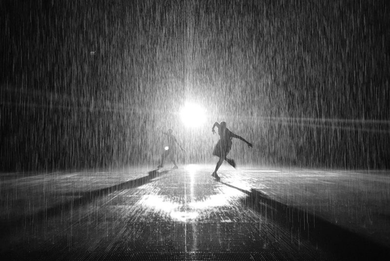 People silhouettes in the Rain Room in Sharjah 