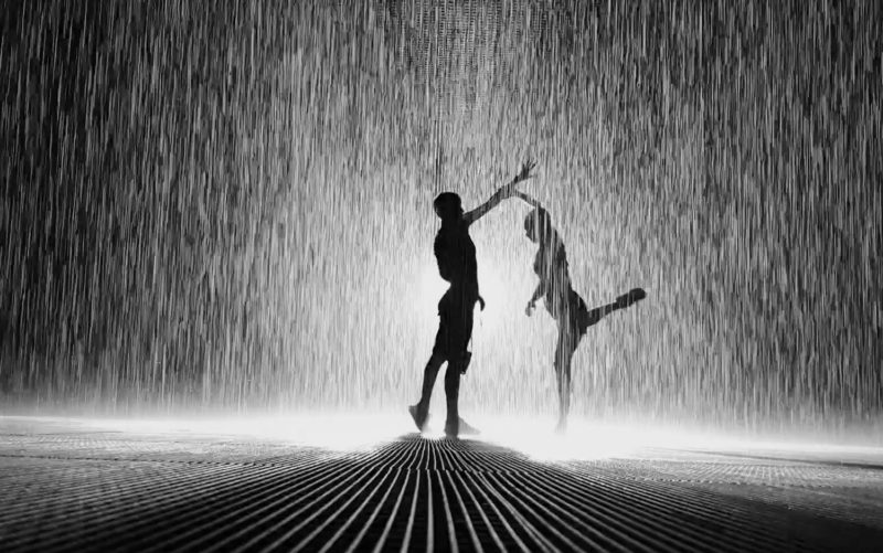 People silhouettes in the Rain Room in Sharjah 