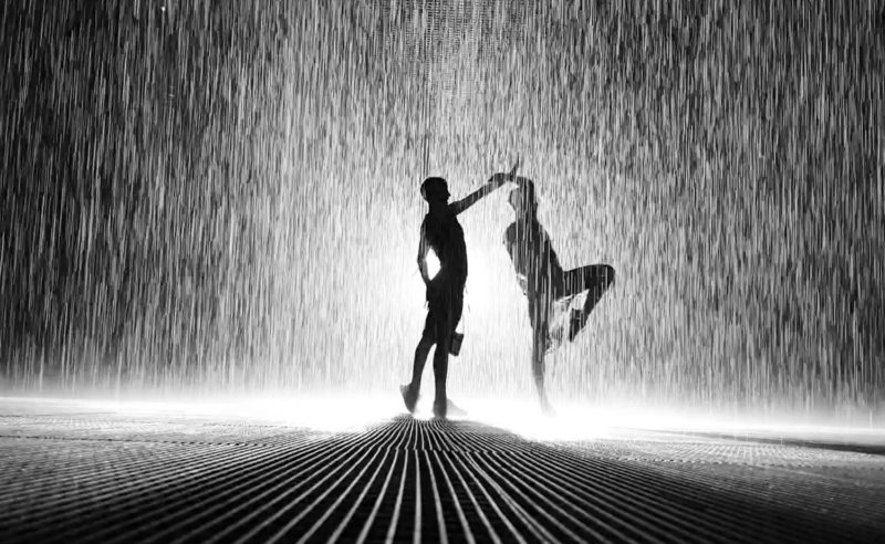 People silhouettes in the Rain Room in Sharjah 