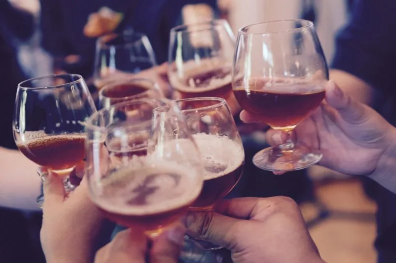 People toasting with glasses