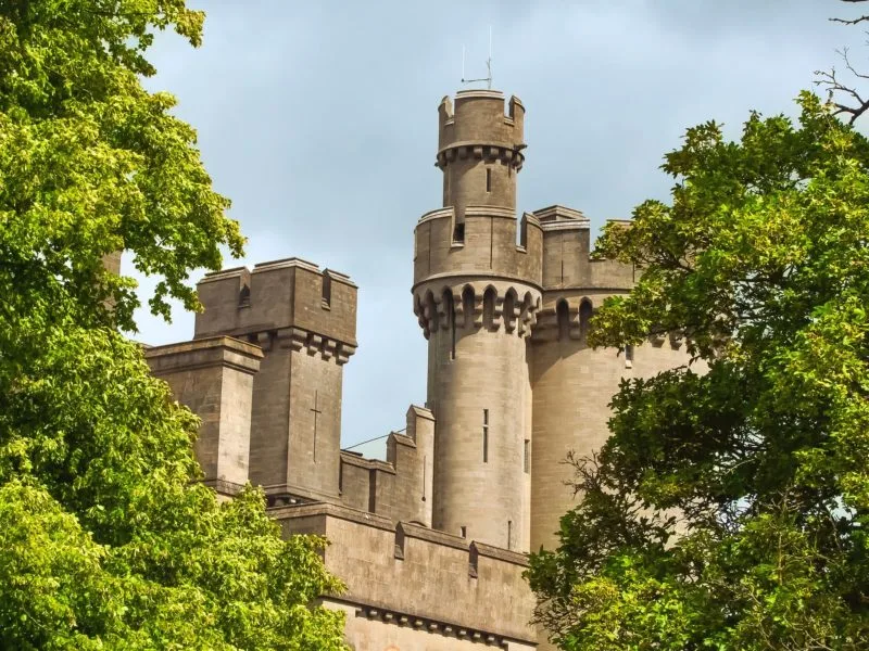 Exterior of Arundel Castle seen between trees