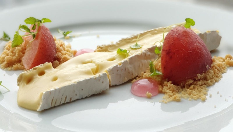 Baron Bigod cheese with poached plum and oat crumble