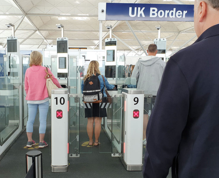 People using Electronic Passport Gates at Airport