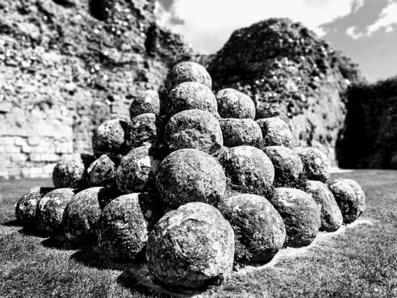 Black and white image of excavated boulders discovered in Pevensey Castle