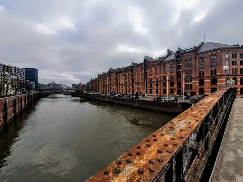 View of Speicherstadt District from a bridge showing warehouses and river