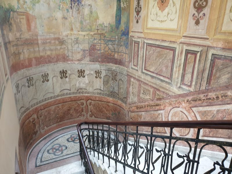 Stairwell displaying some of the ornate frescos in Tbilisi www.roamingrequired.com