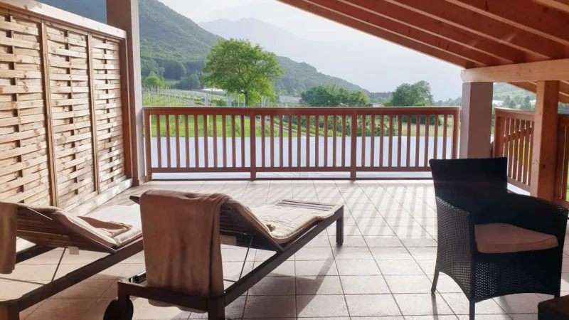 View of deck with mountains and trees in background