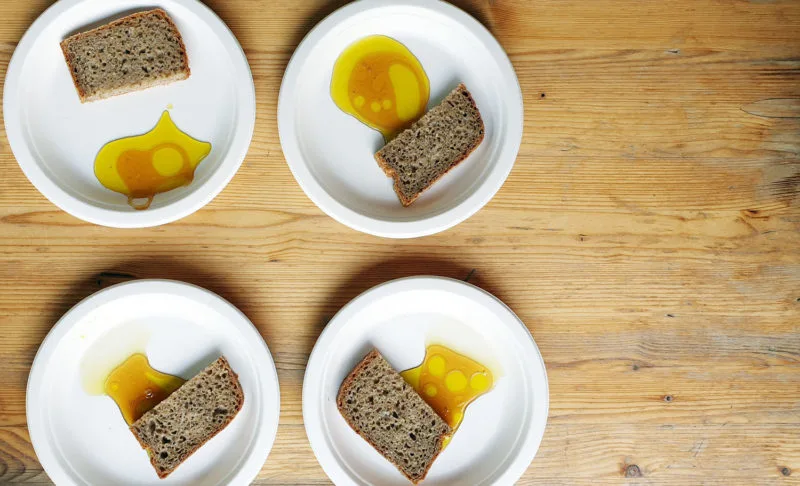 Flat lay of Honey, olive oil & rye bread