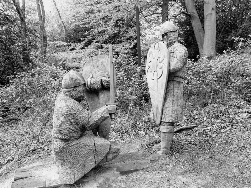 Wooden sculptures along the walking trail in the historic places in the UK Battle Abbey