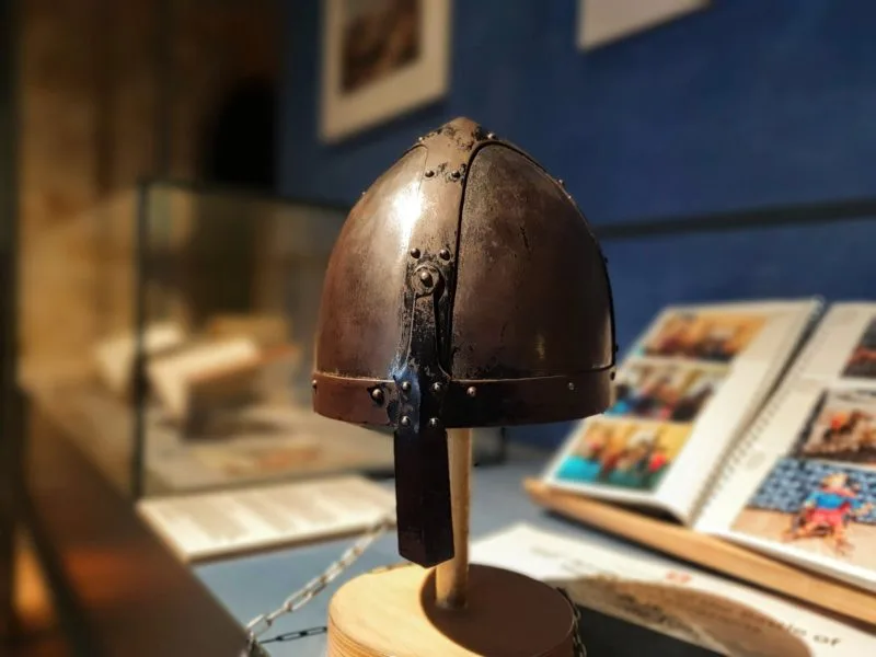 Close up of Norman army helmet on display in Gatehouse Exhibition