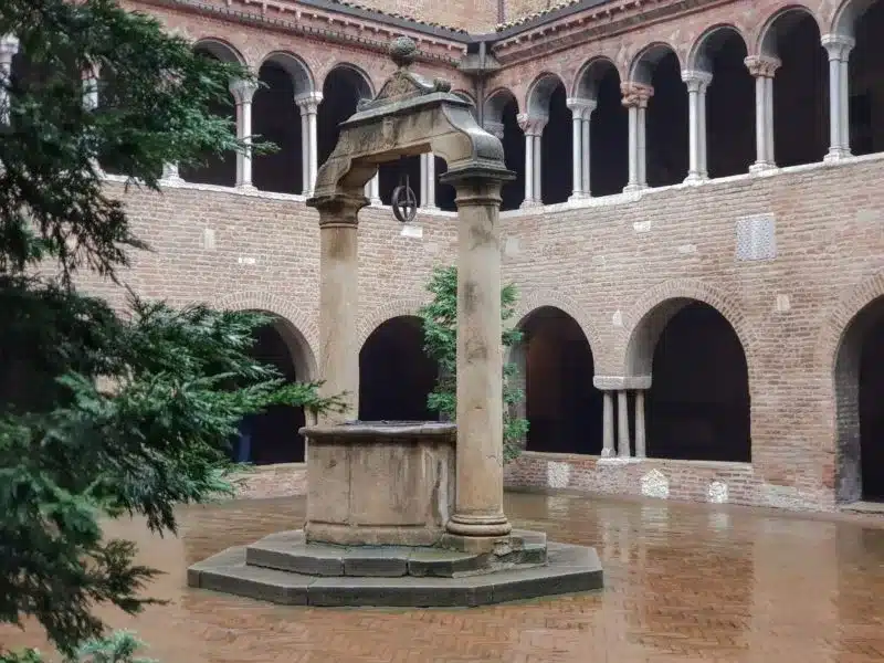A fountain within the courtyard of Basilica di Santo Stefano in Bologna Italy