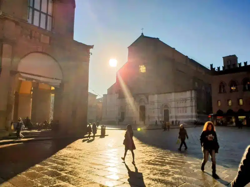 The town square outside the front of Piazza Maggiore in Bologna Italy under the morning sun
