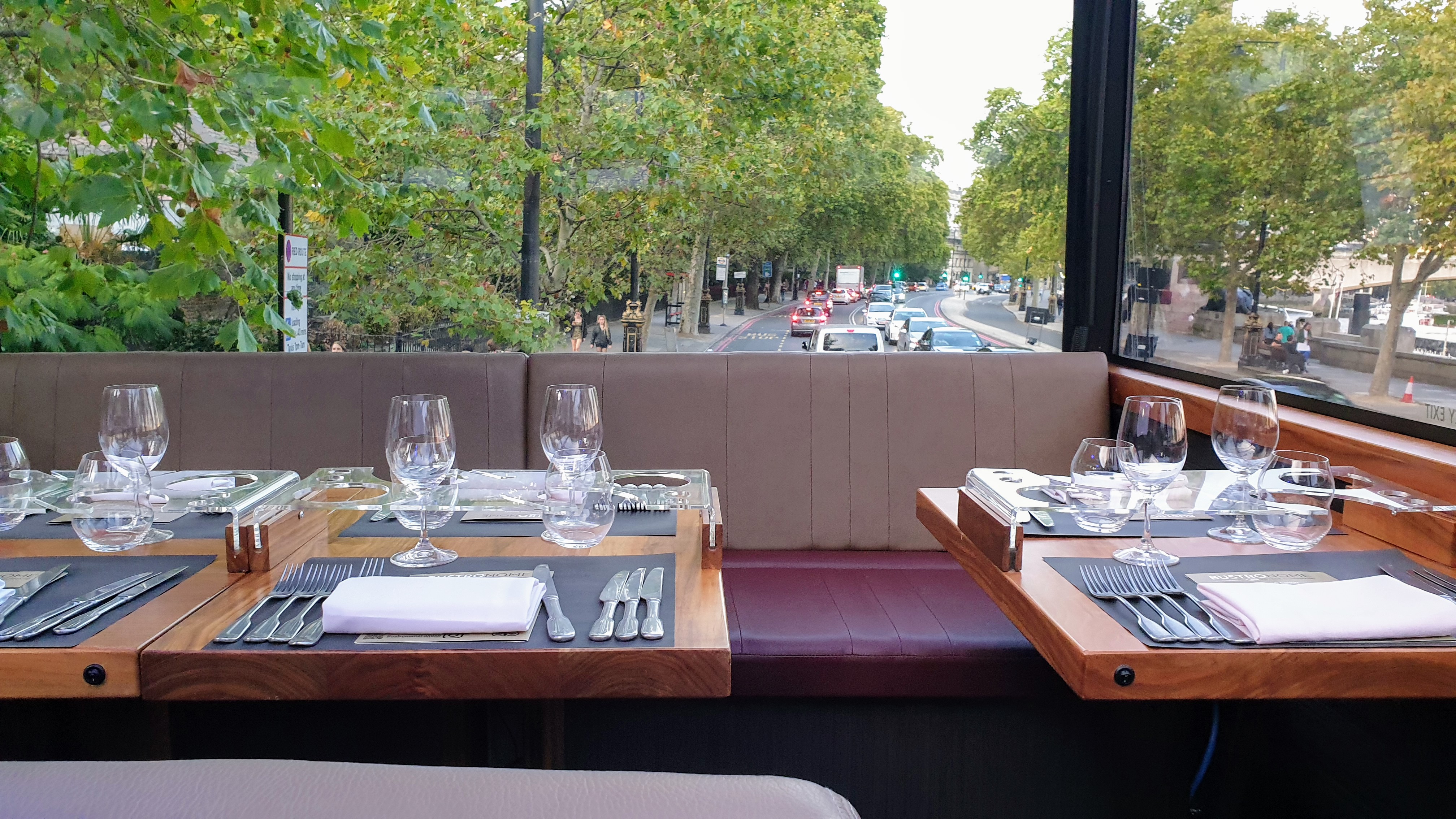 Interior of Bustronome tables in front of glass window