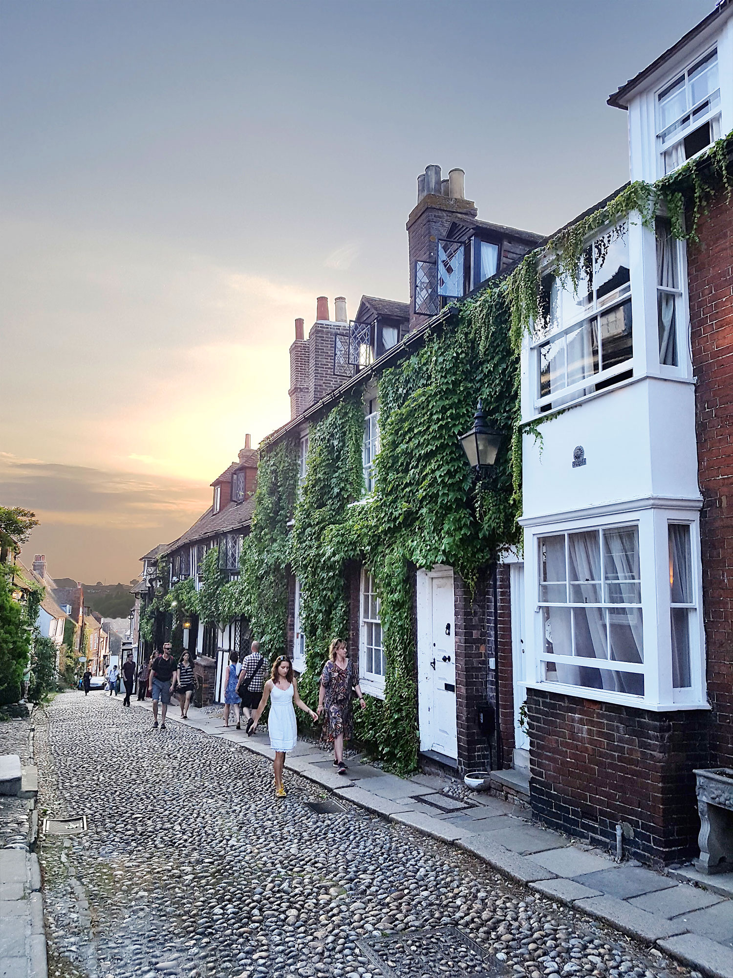 Cobblestone street of Mermaid St in Rye at sunset