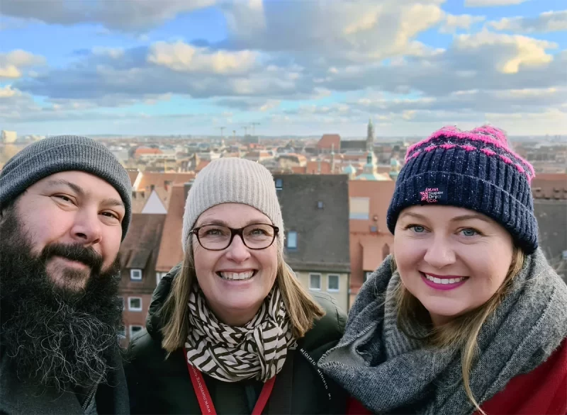 Selfie of Roma and Russ and their guide Claudia Radtke with Nuremberg city in the background