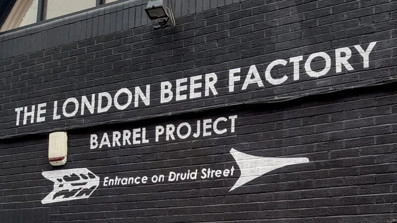 The London Beer Factory signage on black brick wall