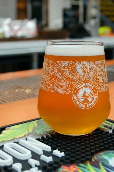 Close up of beer sitting on bar mat