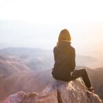 Sitting on a rock starring out into the mountain range