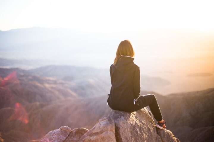 Sitting on a rock starring out into the mountain range