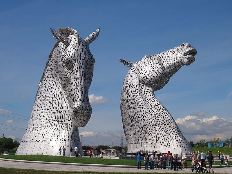 The Kelpies Sculpture which shows a crowd of people at the base of sculpture
