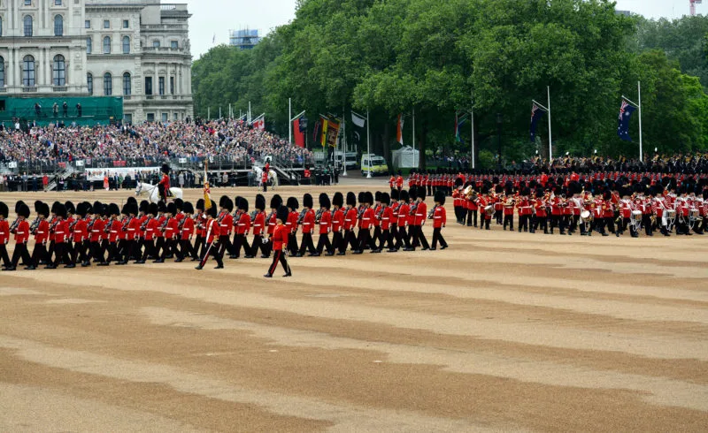 Line of soldiers in ceremonial uniform marching in Trooping the Colour in London