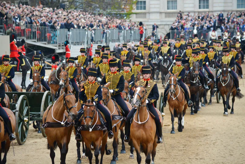 Troops on horseback wearing traditional ceremonial uniform as part of Trooping the Colour in London