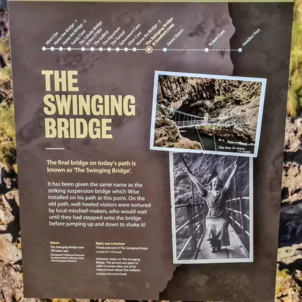 Information board detailing the Swinging Bridge with a picture of a young girl with her hands on the sides of the bridge and swinging in the middle.